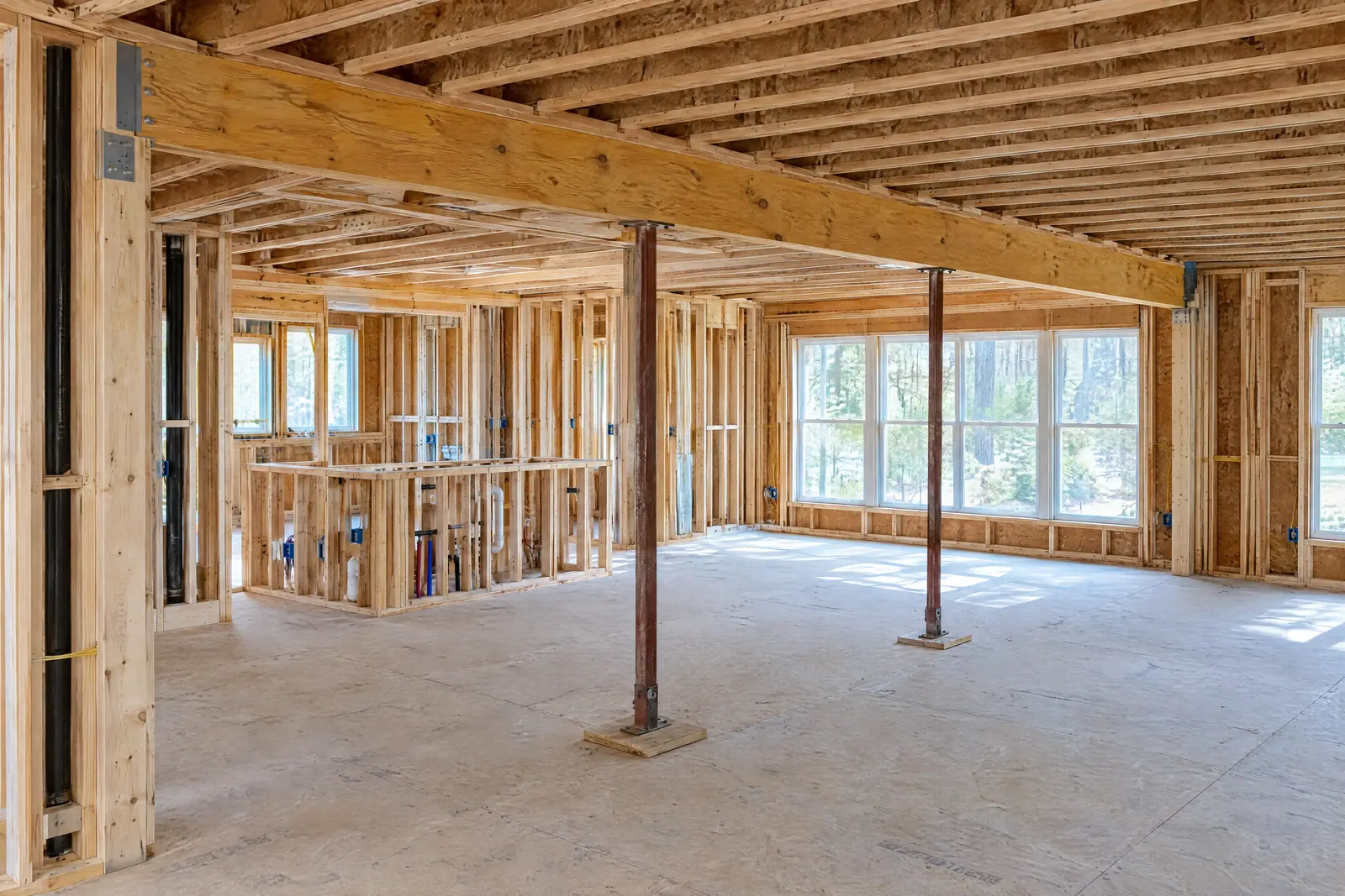 Concept image of a whole-home renovation in progress with a new beam opening the kitchen to the living room